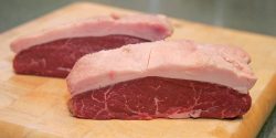 This is the piece that Marjorie rubbed with salt. We have cut the steaks quite thick, and are about to put them on the grill.