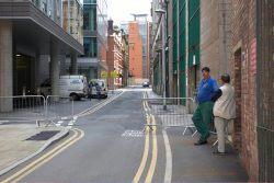 Digby Gribble speaking with Stephen Ware, the independent veterinarian. Whenever Ross was in the theater, Stephen was in attendance. He also checked on Ross in the "secret location" beneath the Magistrates' Court. This small lane is where Ross (watched by his contingent of security guards) entered and exited the Manchester Opera House.