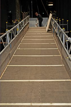 This was our first look at the large ramp built at the back of the stage of the Manchester Opera House for Ross' entrance and exit. Jack Thompson is at the top of the ramp with the "Daisy Lifter" --- a sling to remove Ross from the theater if he just wouldn't walk up the ramp. Of course, Ross was happy to use the ramp, so the "lifter" was not used.