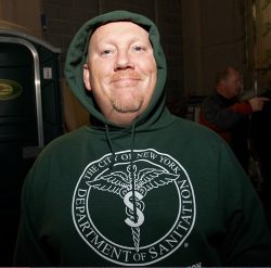 Fez dressed in his costume as a New York City Sanitation Worker.