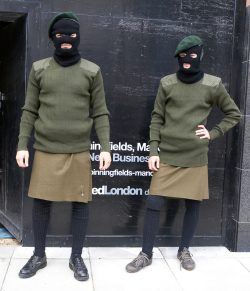 Dressed in kilts and balaclavas.