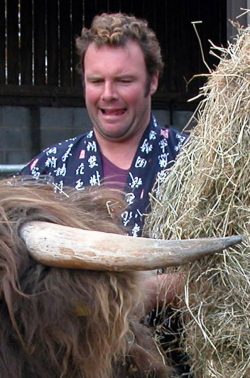 Poor Kevin Howdle. We dressed him up in a yukata and kilt, and asked him to please pose the steer --- and look natural. The steer was fine when just with Kevin, but when we introduced a camera and other friendly onlookers....