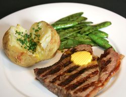 Cooked with a pat of Alderney Island butter (from Guernsey cows), a baked potato with fresh chives, and some snap peas.